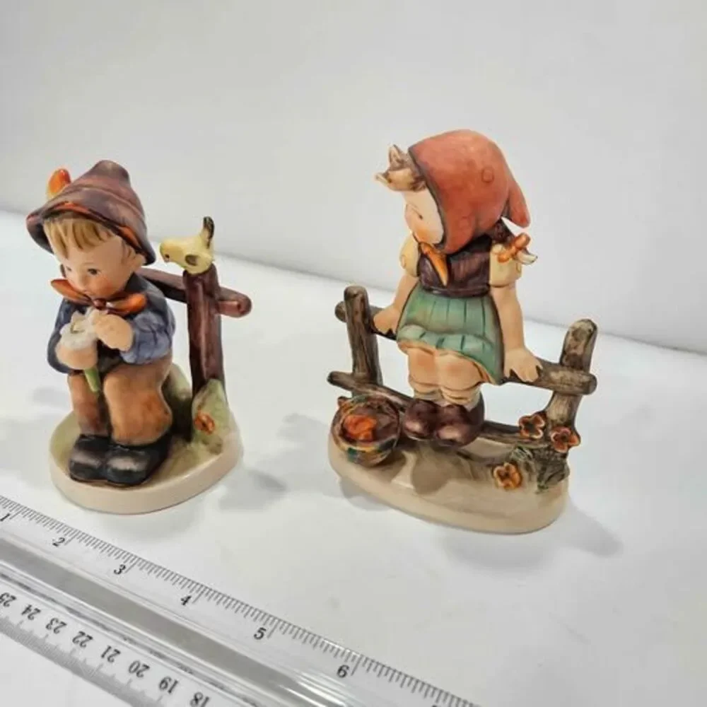 Vintage Hummel Boy and Girl Figurines on Fence